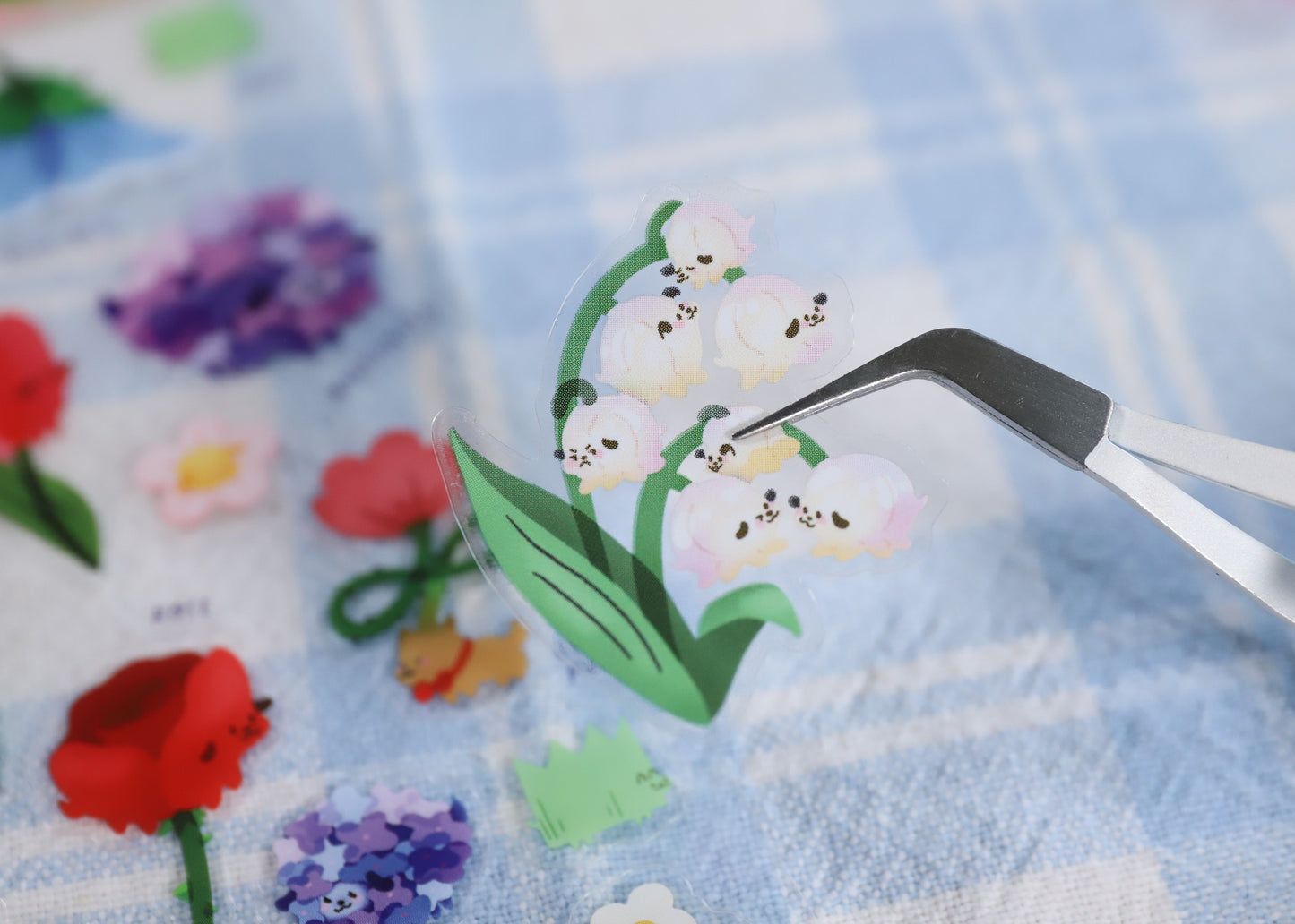 A transparent sticker sheet with various transparent stickers featuring dogs turned into different plants and flowers. Great for journaling and decorating.