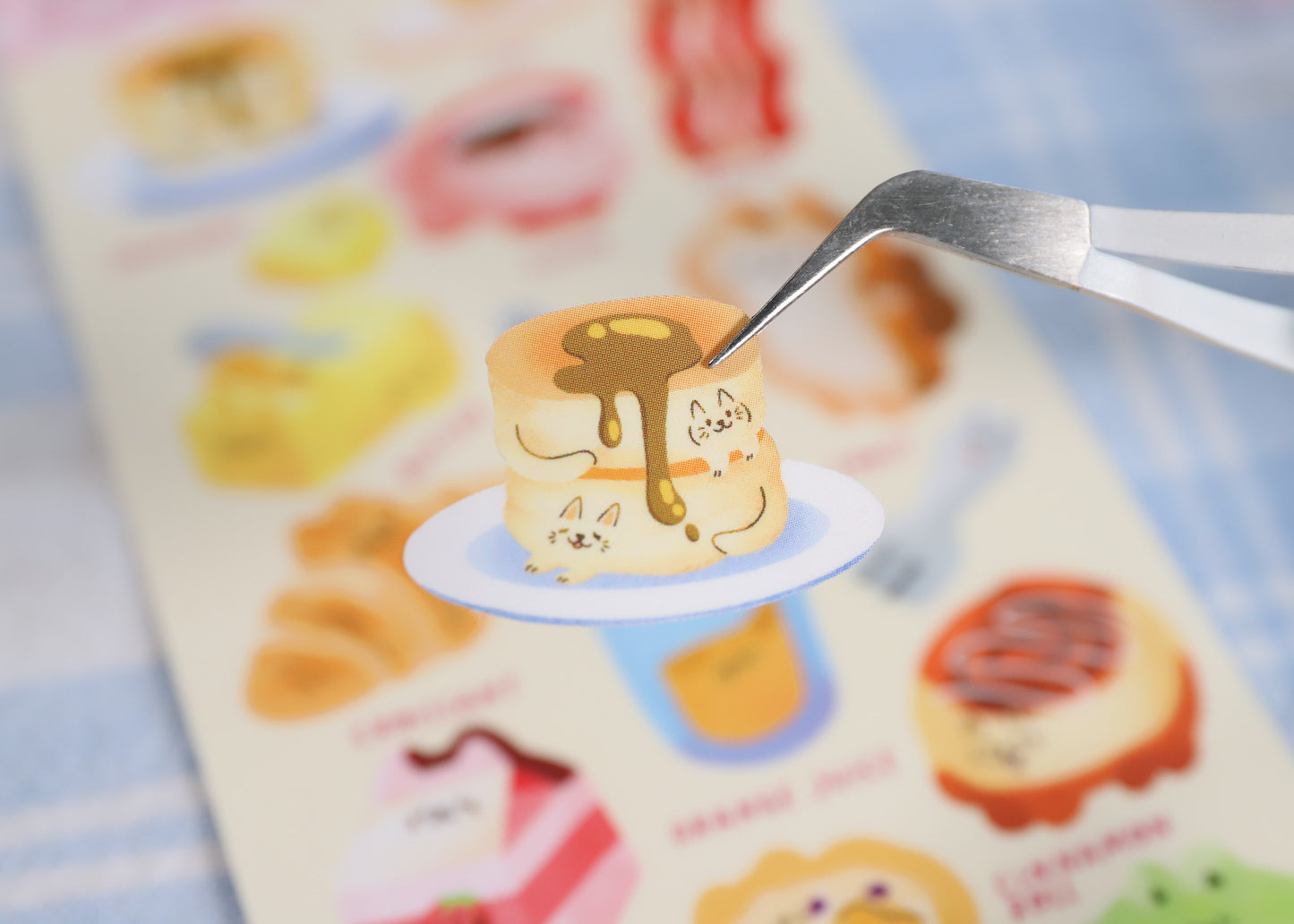 A sticker sheet with various cute brunch-themed stickers, including cats, bacon, eggs, and croissants. Great for decorating planners, and journals. Designed by Reytorra