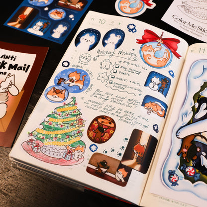 Sticker book with various stickers, including a cat, cake, and other illustrations.