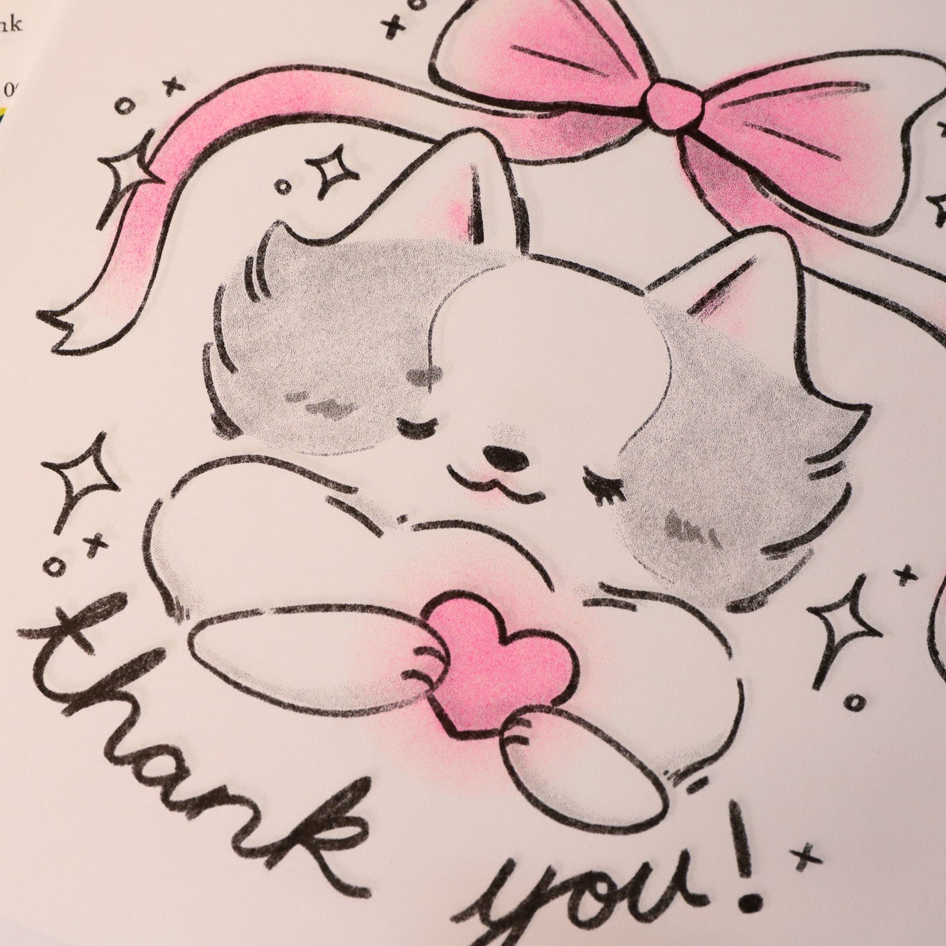 Cartoon cat with a pink bow and 'thank you!' text on a colorful background